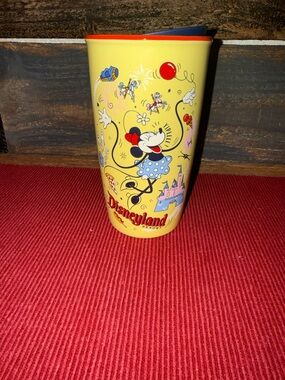 Starbucks Yellow Minnie Mouse Disneyland Travel Cup with Red and Blue Accents